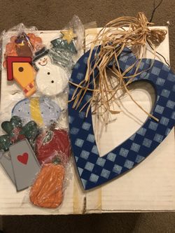 Heart door hanger with holiday inserts.