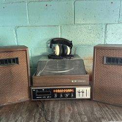 Vintage Sound Design 8 track player with speakers and turntable. 