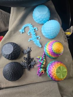 3D printed toy.  $5 per  (twist open and close) egg with wingless dragon, winged dragon or baby t-rex toy inside