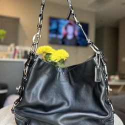Coach vintage black leather hobo bag with silver hardware. 