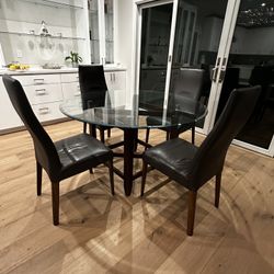 Round 54” Glass Top Dining Table And 4 Chairs - $450
