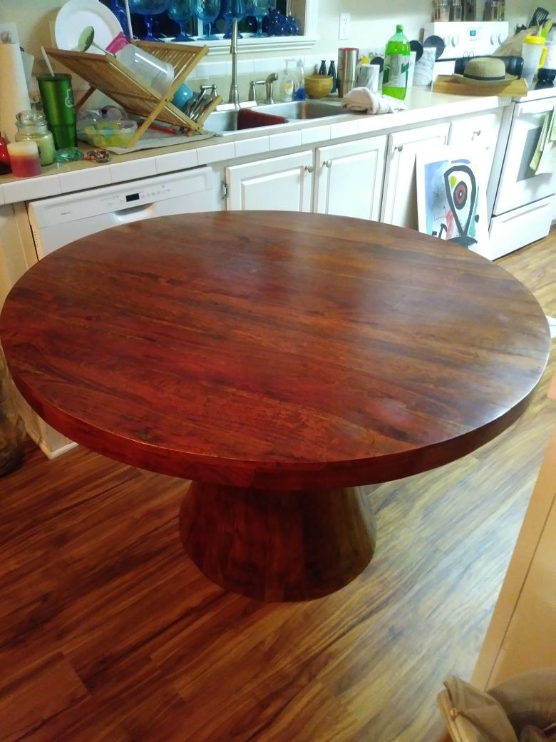 Teak dining table. 48 inches wide.