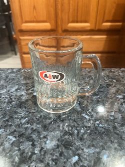 Vintage A & W 3oz Root Beer Mug 3 1/4 inches tall Tall Small Glass.  The front has the logo.  Brand new never used.  Has been on display in a curio ca