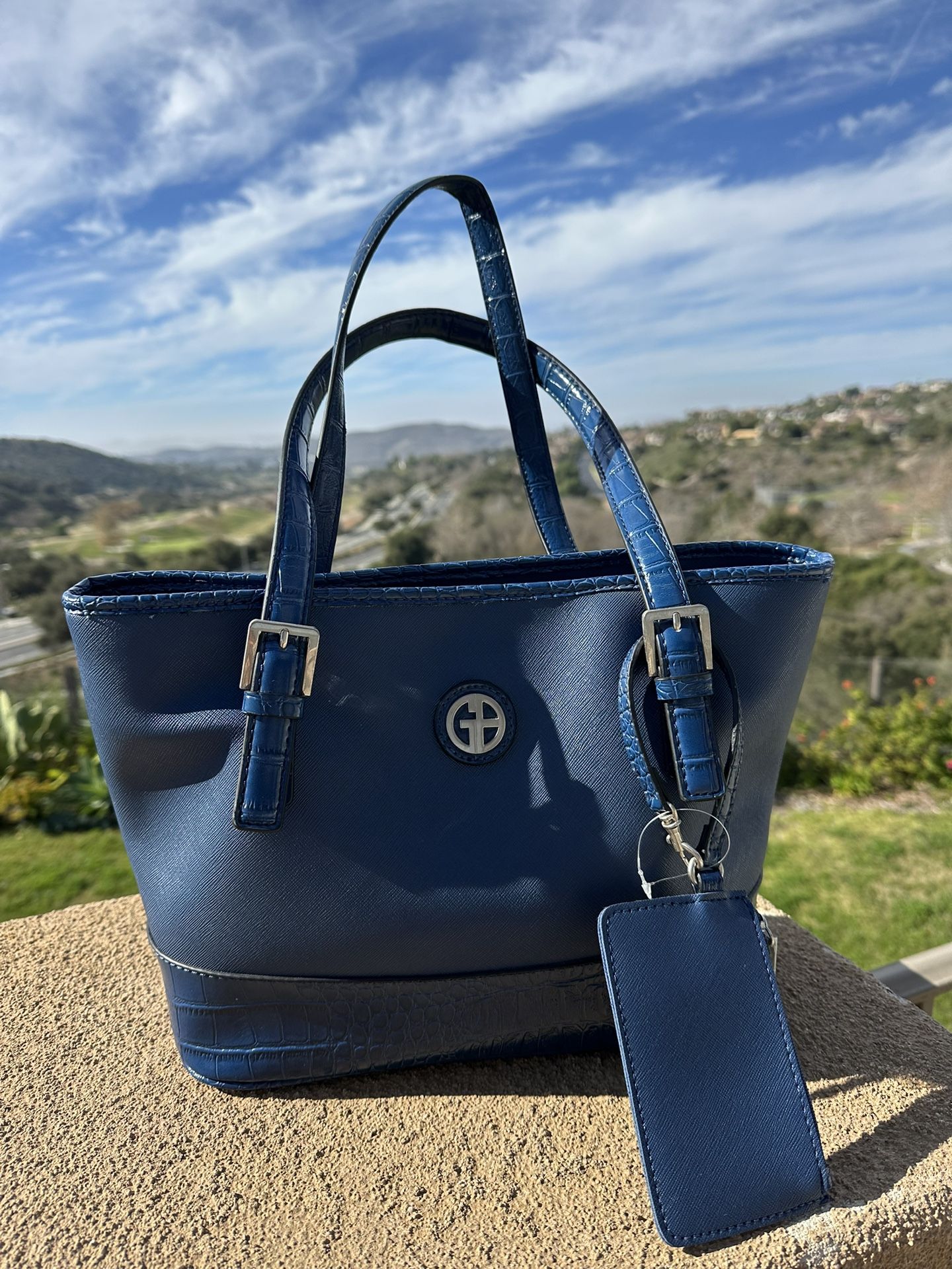 Blue Handbag With Keychain.