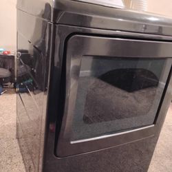 GE Profile hooked to wall Washer and Dryer