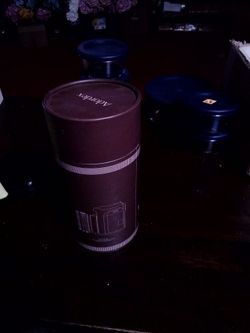 Insulated coffee cup shape of a camera lens