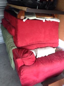 Red suede couch and love seat