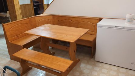 Oak kitchen breakfast nook with storage.
