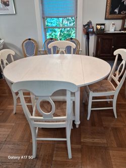 Pottery Barn table 54 by 49 inchs  4 chairs