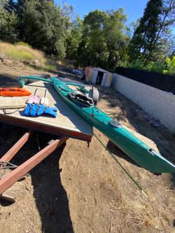 14’ Kayak with 2 outrigger Tribalance life jackets oats throw pillows no cracks or leaks $150  cash 2401 n Euclid ave Upland 91784