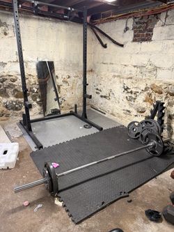 Squat rack and barbell with weights