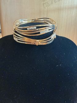 Gold toned bangles with crystal accents
