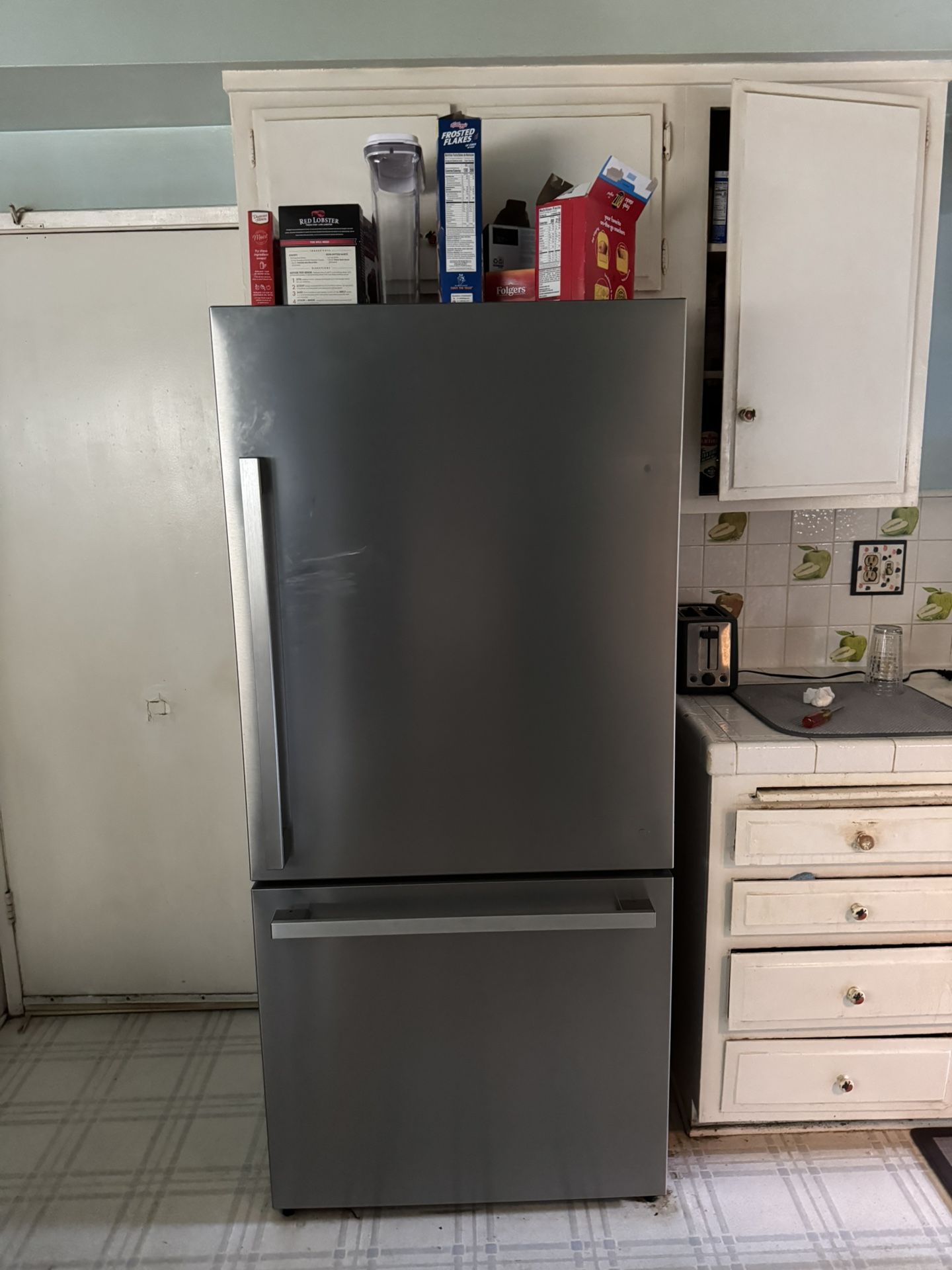 Hisense stainless steel bottom-freezer refrigerator.