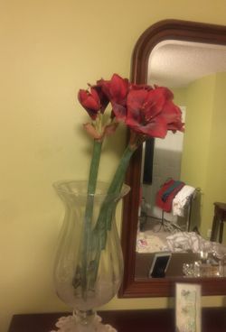 Clear vase with artificial flowers