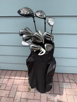 Mens  Nike slingshot golf club set. Complete right handed set with Taylromade woods and golf bag