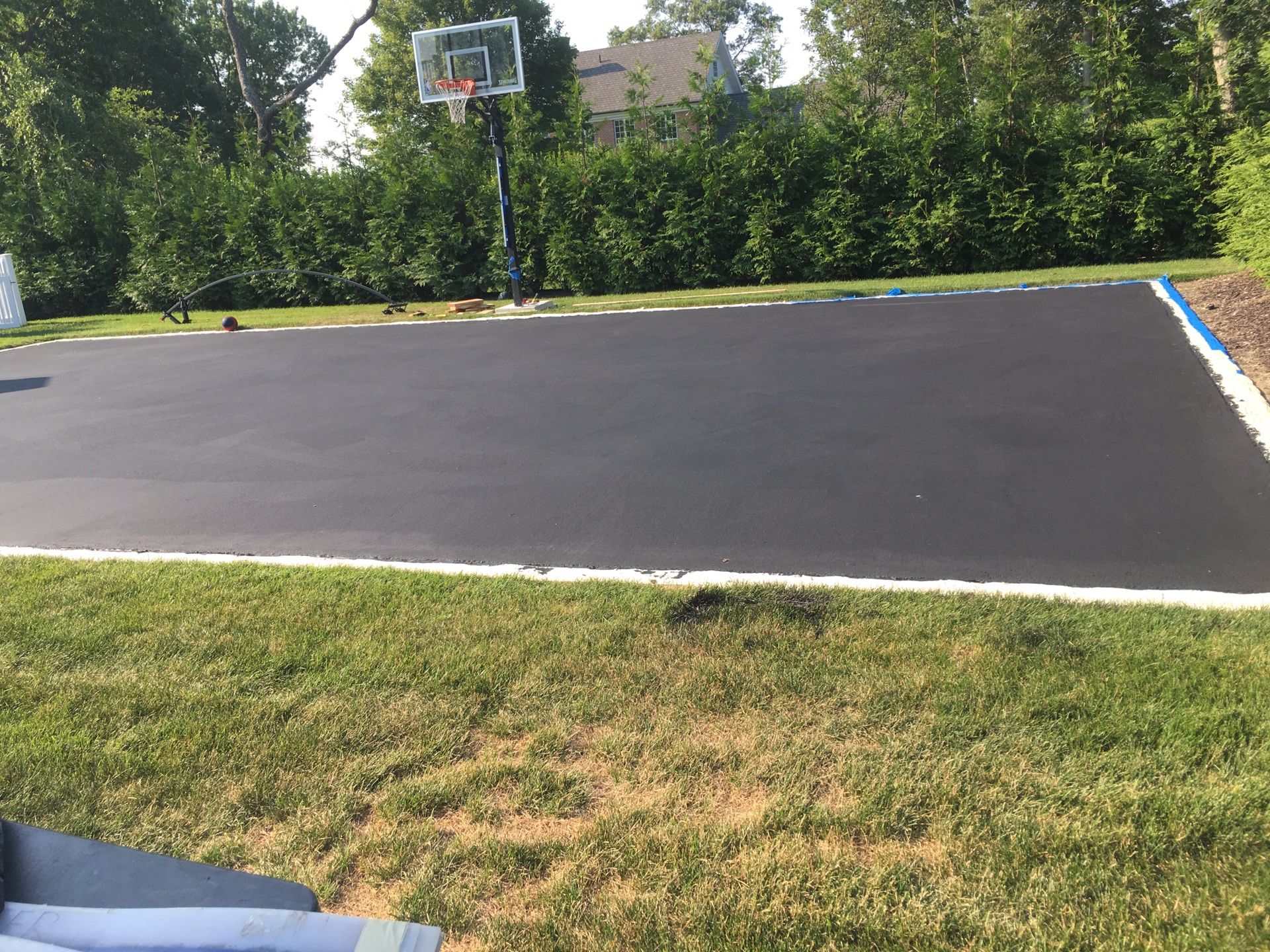 Before and after drive way painting tar basketball courts etc setting up hoops