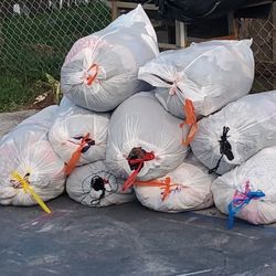 13 Bags Full Of Clothes ,Dresses, Jeans ,sheets And Lots More