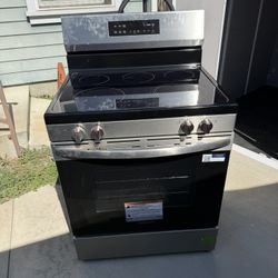 Stainless Steel Frigidaire Electric Stove , Microwave And Dishwasher 