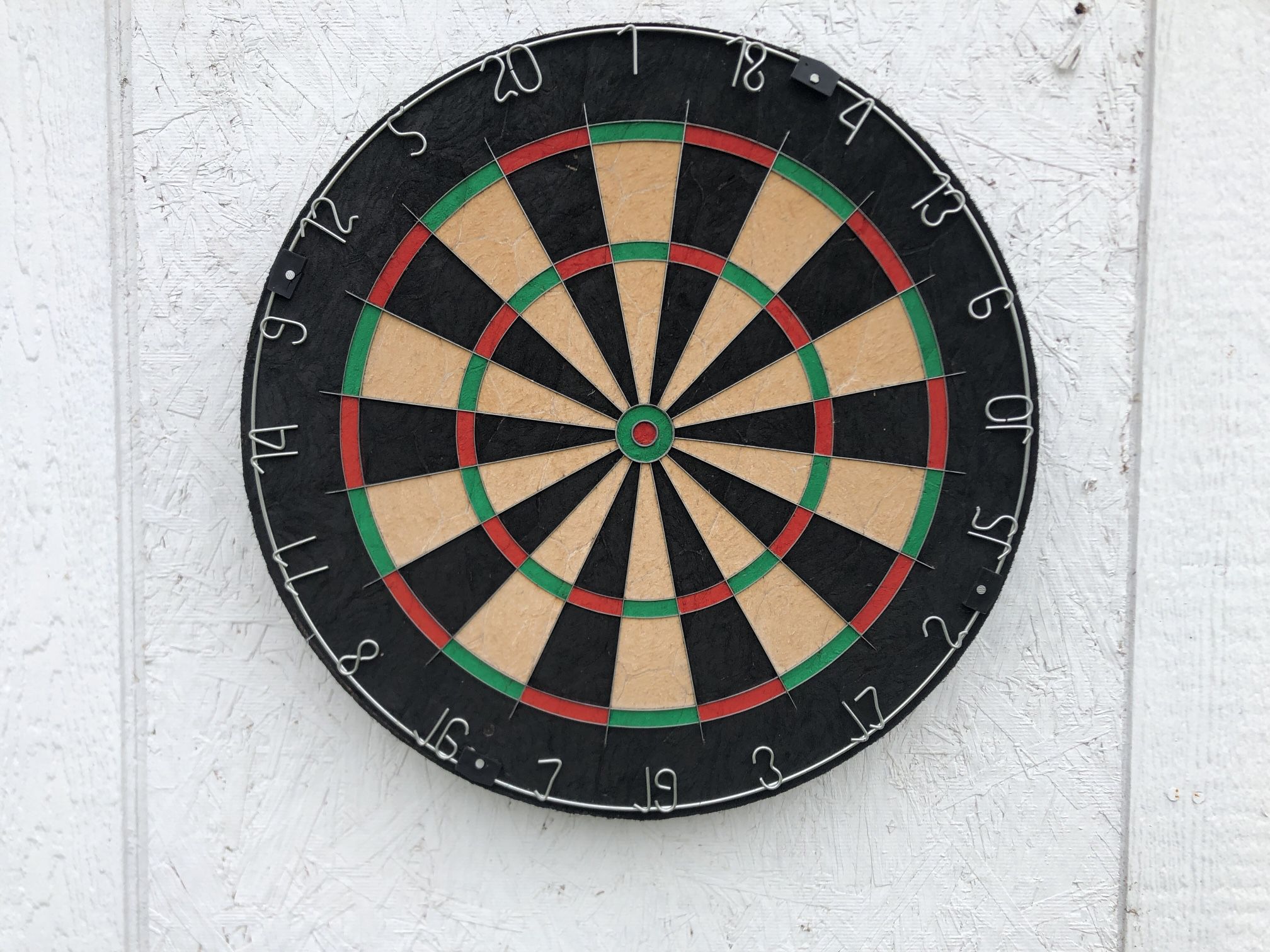 Dart board with used darts