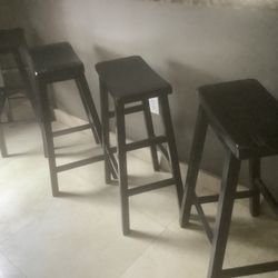 Three wooden stools