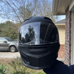 DOT-approved full-face motorcycle helmet in matte black.