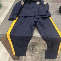Kids Size Medium Spirit Halloween Official Deluxe Police Costume - Uniform, Hat, Belt, Walkie Talkie, Handcuffs New Condition