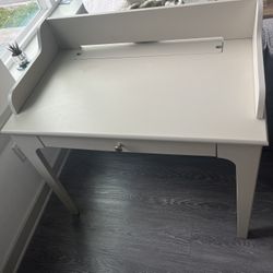 Light grey desk with drawer