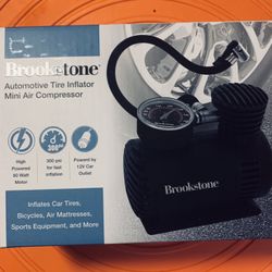 BROOKSTONE  AUTOMOTIVE TIRE INFLATOR MINI AIR COMPRESSOR  - NEW AND SEALED IN BOX 80 WATT HIGH POWERED 300 PSI POWERED BY 12 V car OUTLEET
