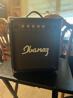 This is an Ibanez acoustic guitar amplifier (model IBZ 10 A)—120V AC, 50-60 Hz, 12W—featuring a compact design and a black grille. It measures 10" x 1