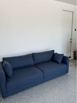 Excellent condition 3 seater sofa. Navy blue performance fabric.