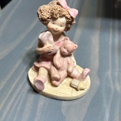 Little Girl With Bear Figuring