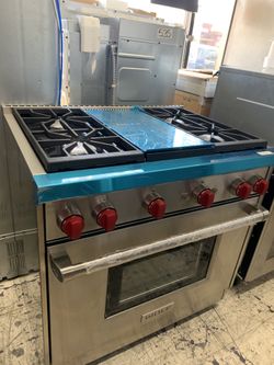 Wolf 36” slide in range with middle grill in stainless steel