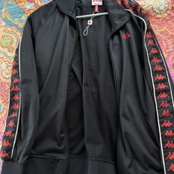 classic Kappa 222 Banda‐style track jacket in black with red “Omini” logo taping on the sleeves.