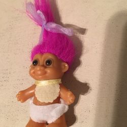 2 inch baby troll wearing bib and diaper, 5 inches including hair