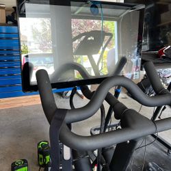 Peloton With Multiple Accessories And Pad