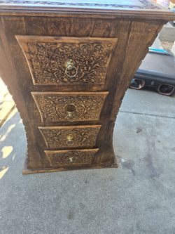 Hand-Carved Wooden Dresser with Brass Ring Pulls