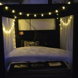 Black new canopy bed frame