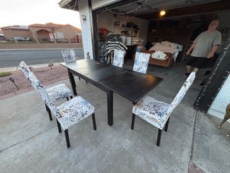 Dinner table with leaf and  6  chairs,can deliver