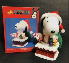 Peanuts 10.75” Snoopy Santa Animated and Musical Tablepiece
