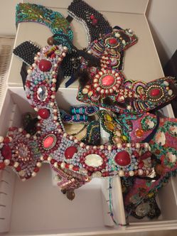 A box of handmade unique expensive pieces of gems and other natural and artificial stones