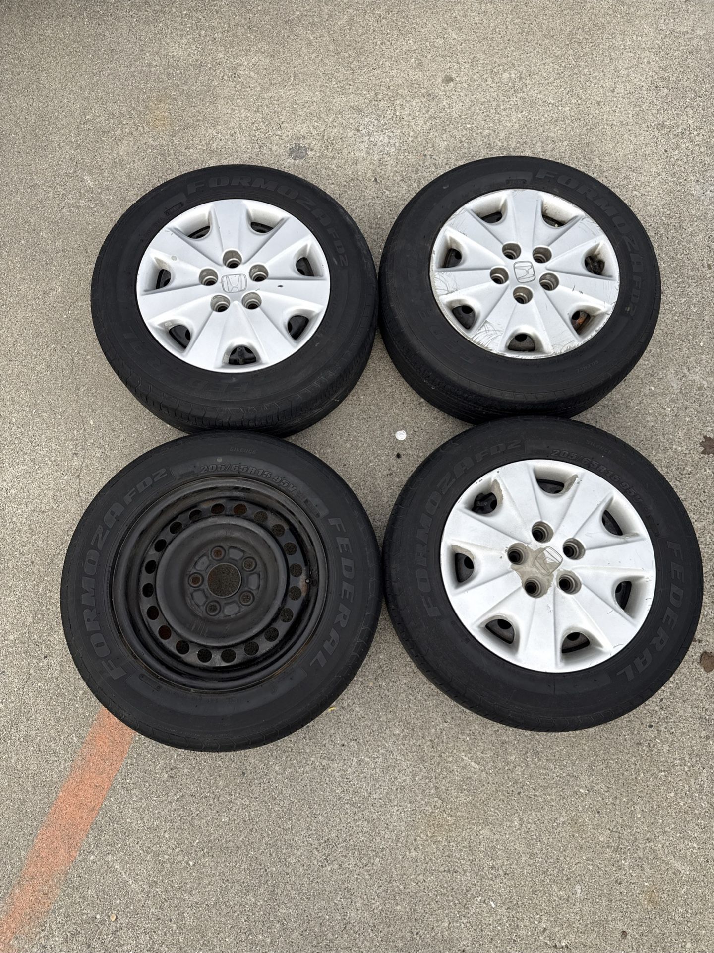 4 Rims And Tires One Missing Hub Cap  