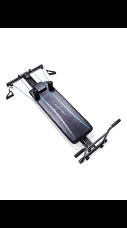 Flow form Pilates reformer exercise machine