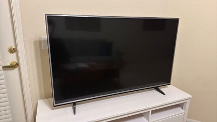 LG 55 inch television with remote, power adapt, and cable