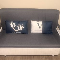 Sofa bed includes two small pillows