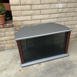 Television Stand. TV Stand. In Excellent Condition. 2 Shelves And Glass Doors. Sturdy 