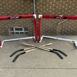 Mylec hockey equipment, 2 folding goals and 4 street hockey sticks