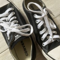 Converse Black & White Low Top Size 7 in womens and Size 5 in mens