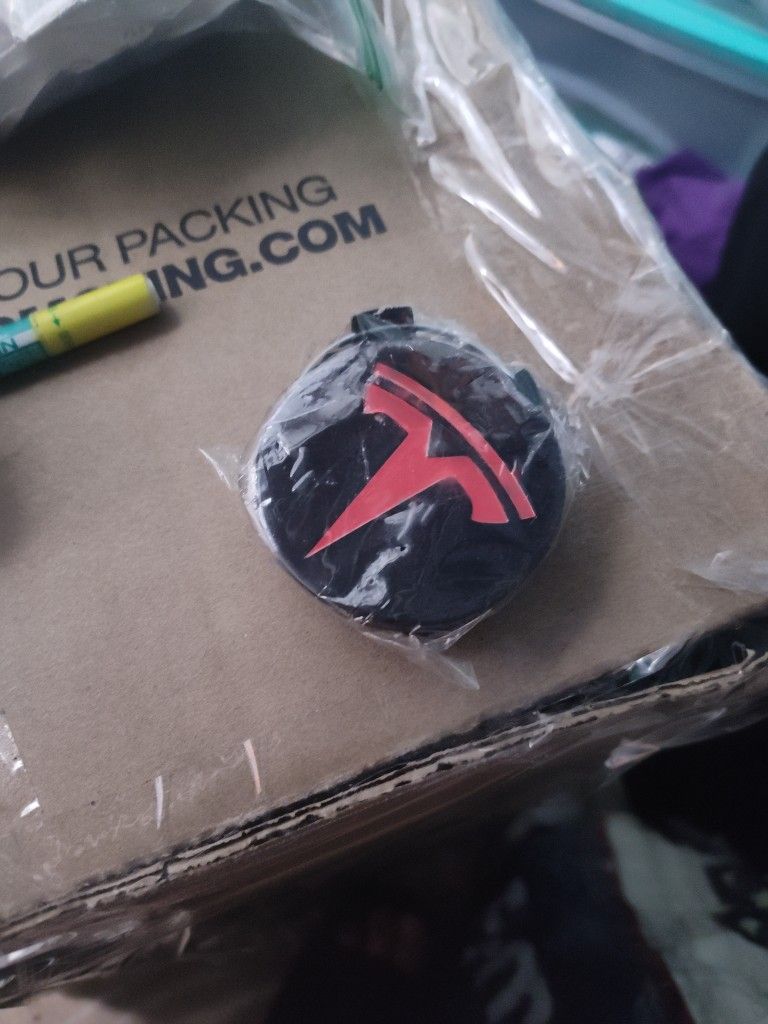 2x Red & Black Tesla Center Caps of 57mm.