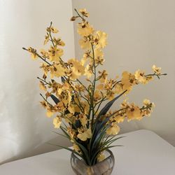 Faux Yellow Flowers In Clear Vase With Faux Water