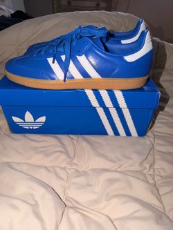Blue and white Adidas samba og